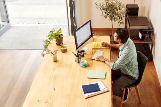 Man-sitting-at-a-desk