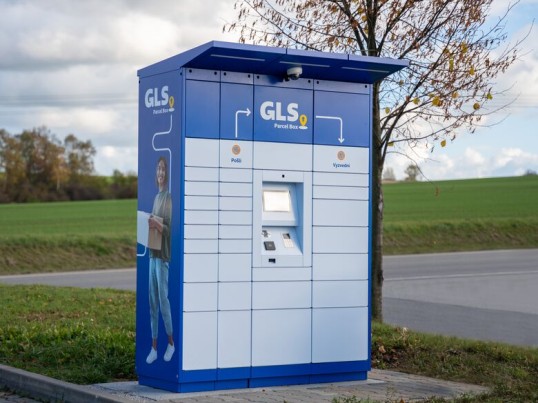 man walking from a gls parcel shop