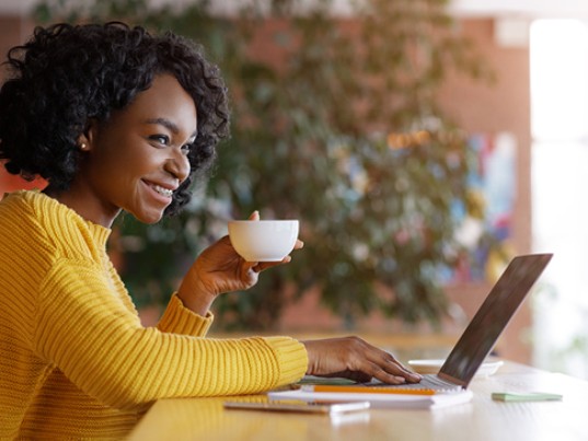 Sitting smiling couple following parcel tracking on the tablet