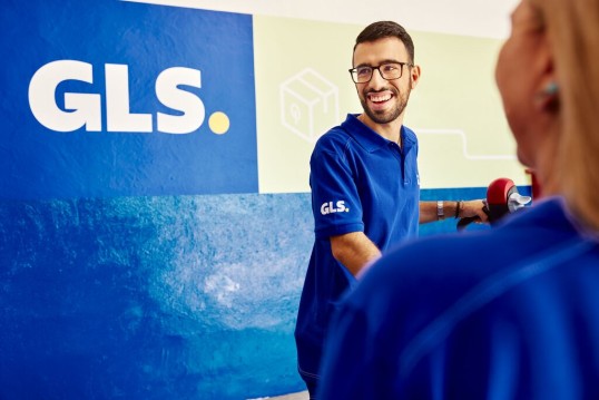 two men with parcels in a warehouse