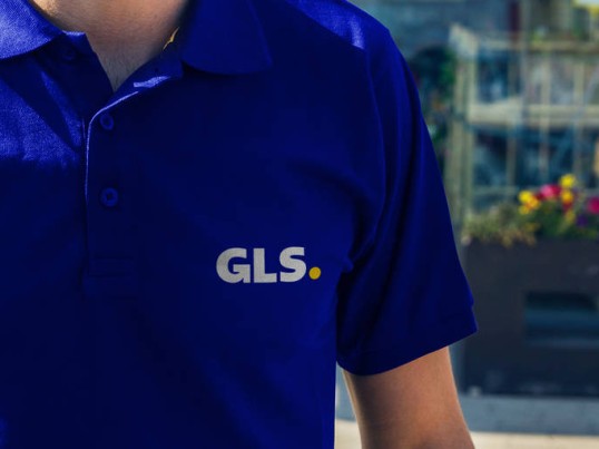 GLS driver in front of a Parcel Shop