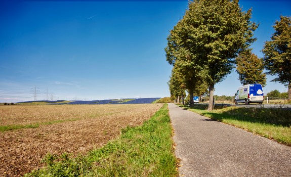 GLS e-van in nature with solar panels