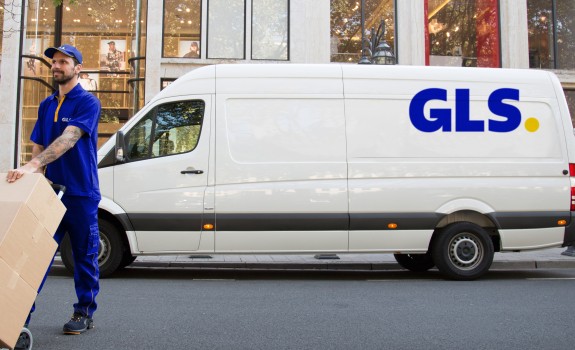 photo of a delivery man with a van in the background 