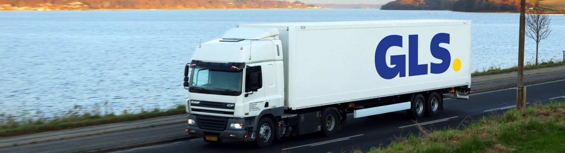 truck driving down road 